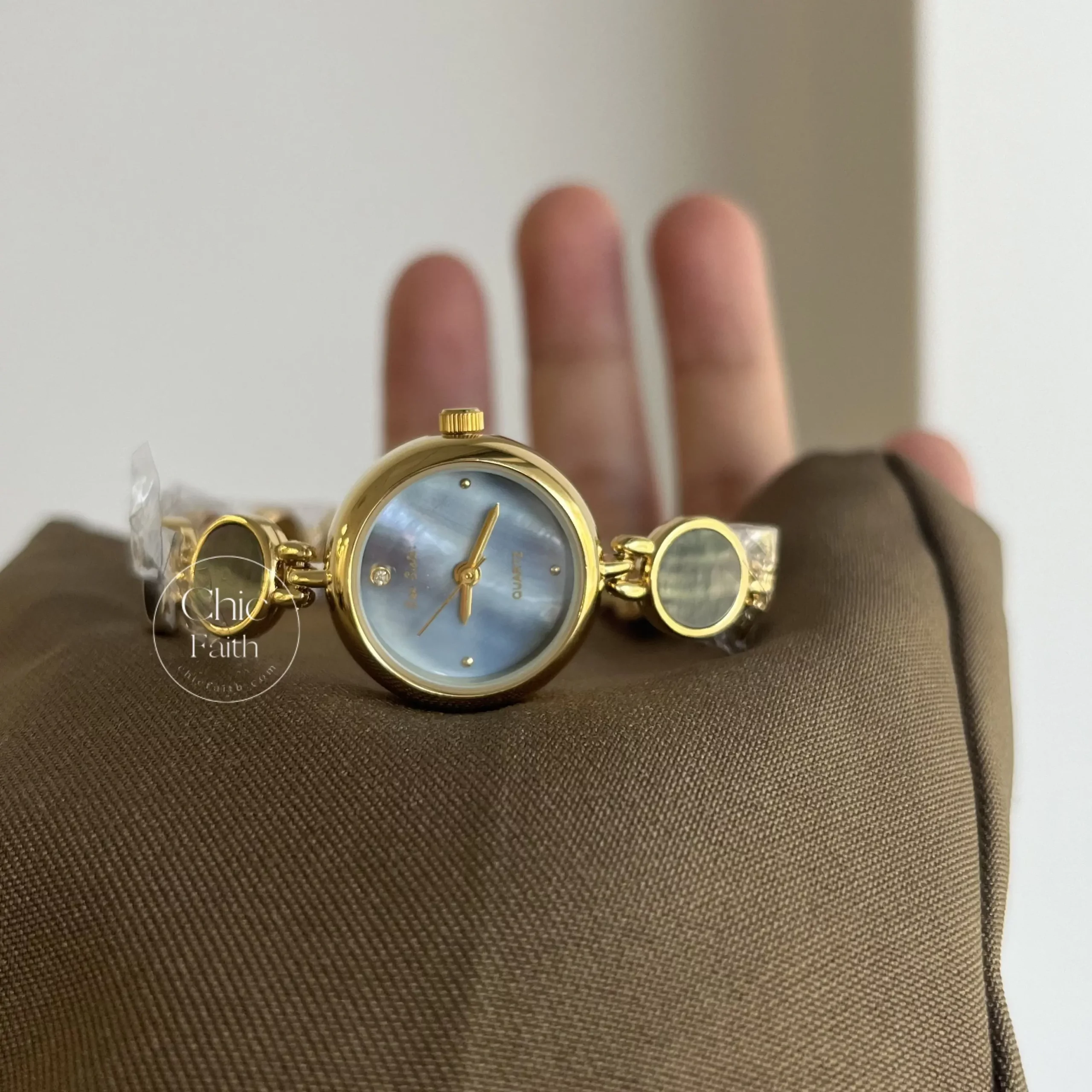Womens Gold Round Face Watch Blue Mother of Pearl Watch