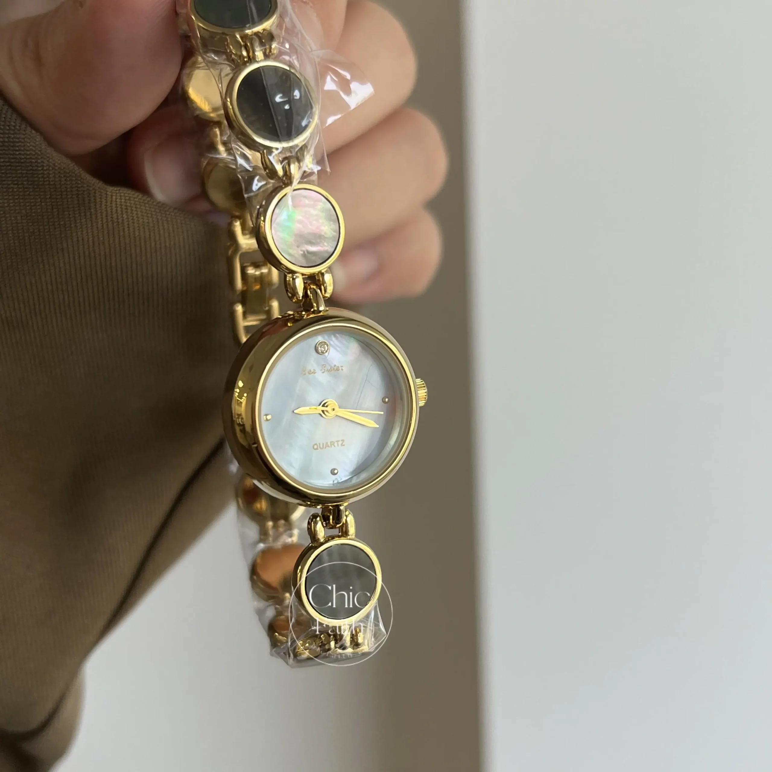 Womens Gold Round Face Watch Blue Mother of Pearl Watch