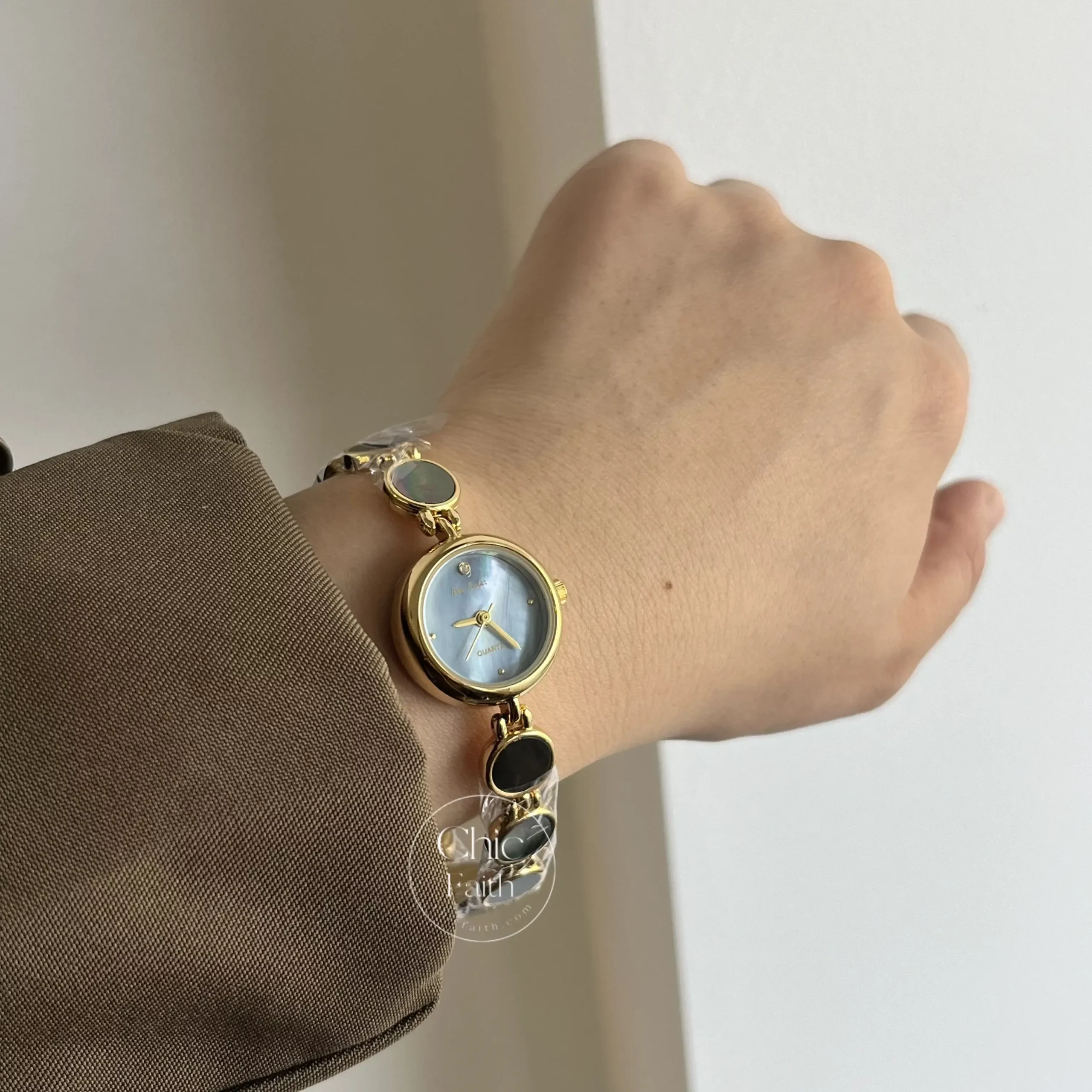 Womens Gold Round Face Watch Blue Mother of Pearl Watch